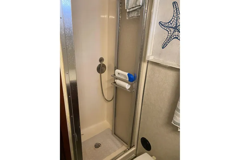 Slide: The Image of Shower area in 1972 Hatteras 38 Double Cabin with starfish decor. - 12