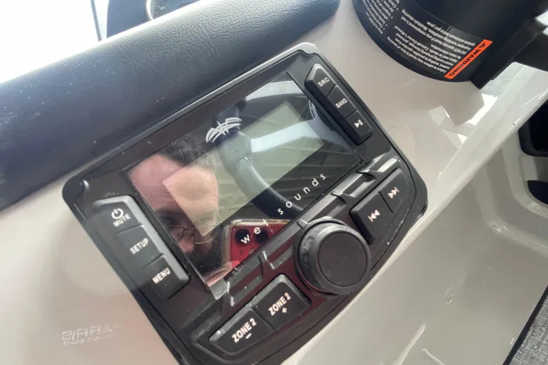 Slide: The Image of Audio control panel on 2026 Harris Cruiser 210 SLDH boat dashboard. - 10