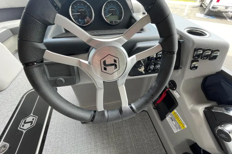 Slide: The Image of Steering wheel and dashboard of 2026 Harris Cruiser 210 SLDH boat. - 11