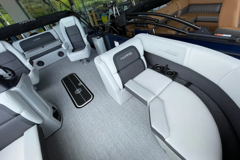 Slide: The Image of 2026 Harris Cruiser 210 SLDH pontoon boat interior with modern seating and cup holders. - 12