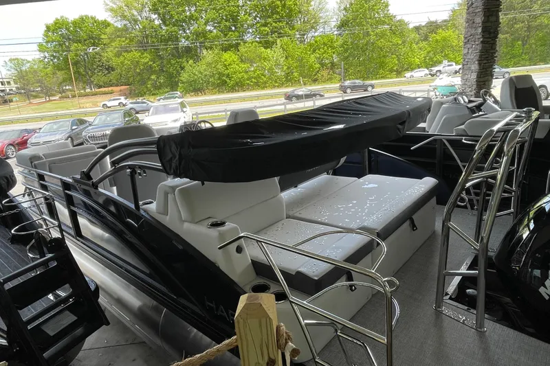 Slide: The Image of 2026 Harris Cruiser 210 SLDH pontoon boat with sleek seating and modern design. - 19