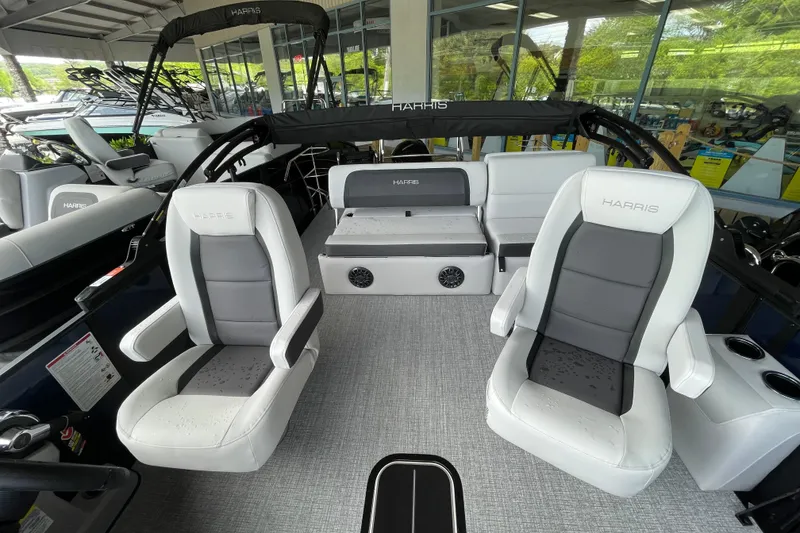 Slide: The Image of 2026 Harris Cruiser 210 SLDH pontoon boat interior with modern seating and sleek design. - 2