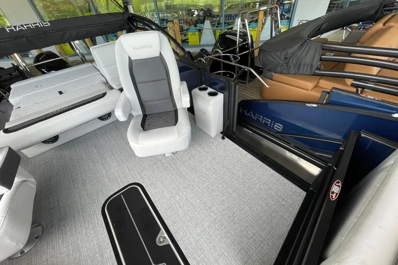 Slide: The Image of 2026 Harris Cruiser 210 SLDH interior with modern seating and sleek design. - 6