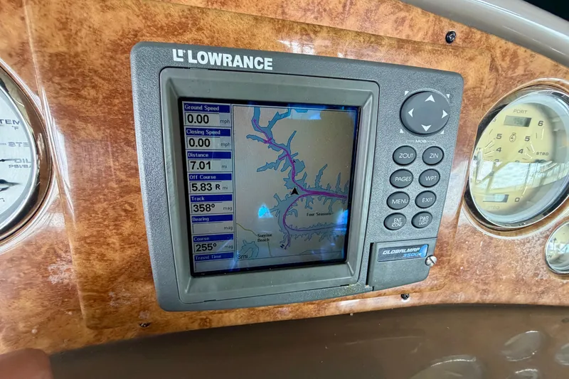 Slide: The Image of Lowrance GPS display on 2006 Rinker 300 Express Cruiser dashboard. - 13