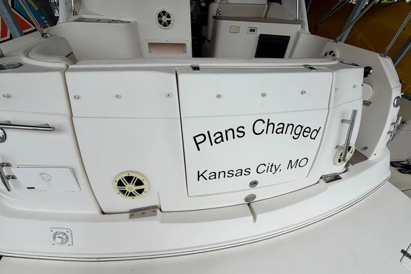 Slide: The Image of 2006 Rinker 300 Express Cruiser with "Plans Changed" text, Kansas City, MO. - 2