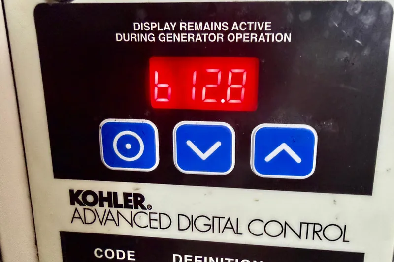 Slide: The Image of Kohler digital control panel displaying "612.8" on a 2006 Rinker 300 Express Cruiser. - 21
