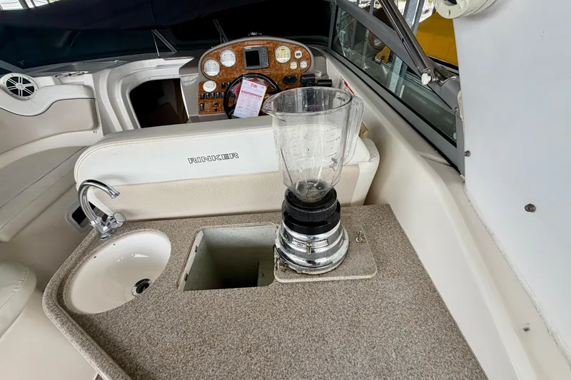 Slide: The Image of 2006 Rinker 300 Express Cruiser interior with sink and blender on countertop. - 6
