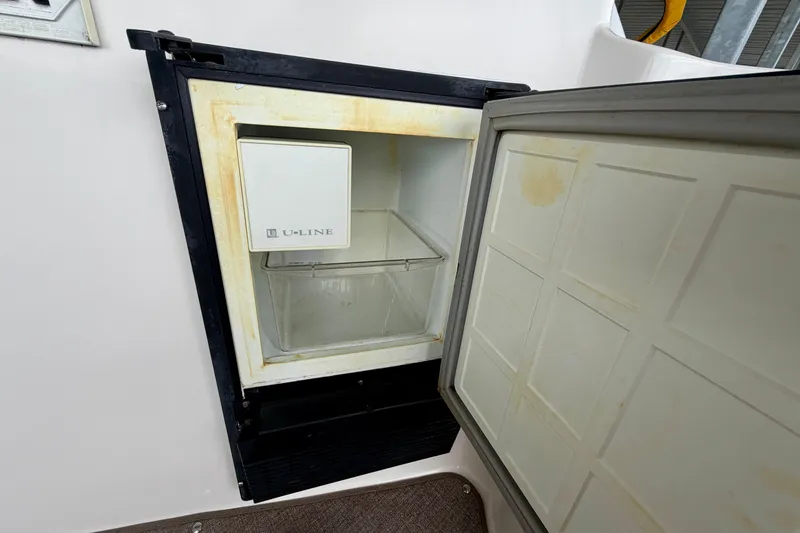Slide: The Image of Open U-Line ice maker on 2006 Rinker 300 Express Cruiser boat. - 7