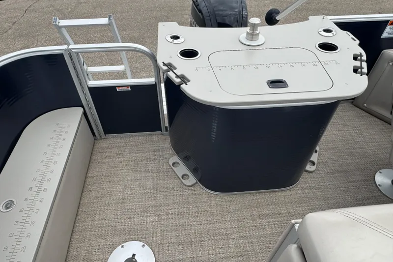 Slide: The Image of 2018 Bennington 22 SFX boat interior with fishing station and measuring ruler. - 14