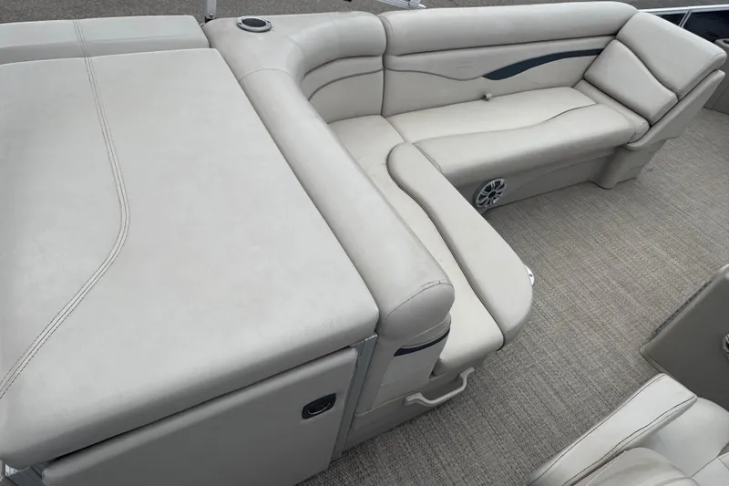 Slide: The Image of 2018 Bennington 22 SFX boat interior with beige seating and carpeted flooring. - 15