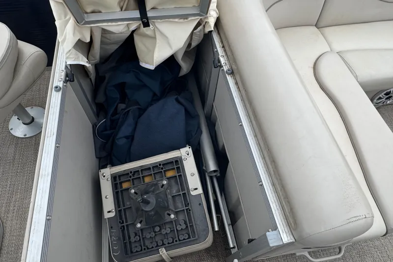 Slide: The Image of Storage compartment of a 2018 Bennington 22 SFX boat with seat cushions and equipment. - 16