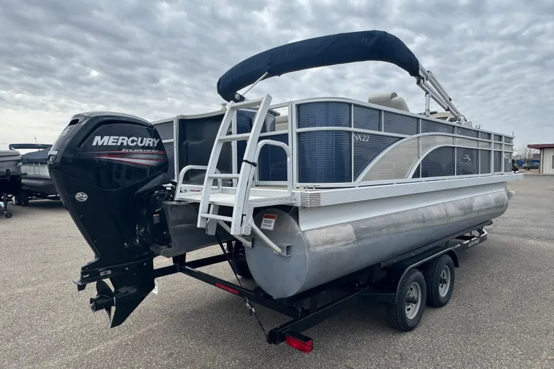 Slide: The Image of 2018 Bennington 22 SFX pontoon boat with Mercury outboard motor on trailer. - 3