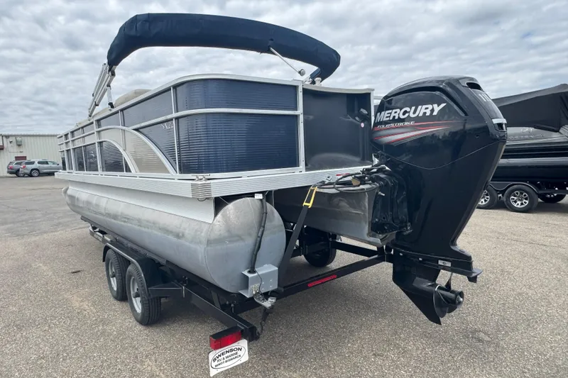 Slide: The Image of 2018 Bennington 22 SFX pontoon boat with Mercury outboard motor on trailer. - 4