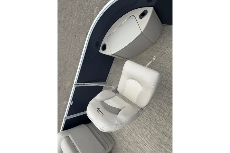 Slide: The Image of 2018 Bennington 22 SFX boat interior with beige seating and storage compartment. - 5