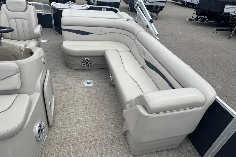 Slide: The Image of 2018 Bennington 22 SFX boat interior with beige seating and carpeted flooring. - 8