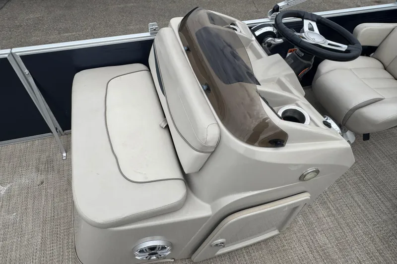Slide: The Image of 2018 Bennington 22 SFX boat interior with steering console and seating area. - 9