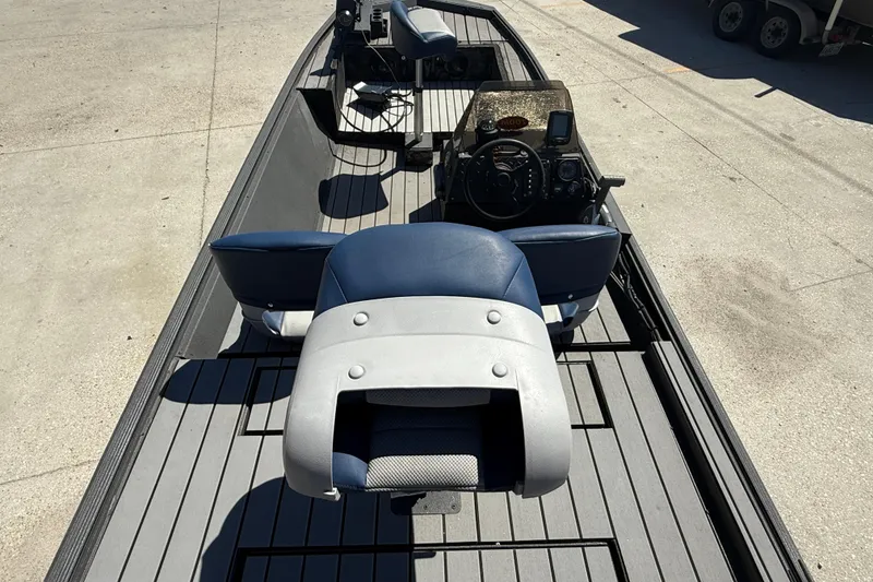 Slide: The Image of 1996 Duracraft 16 SC boat interior with blue and gray seating, steering console, and equipment. - 7