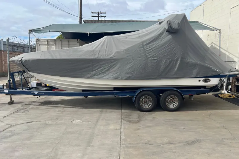 Slide: The Image of Covered 2007 Chaparral 256 SSi boat on trailer in a parking area. - 12