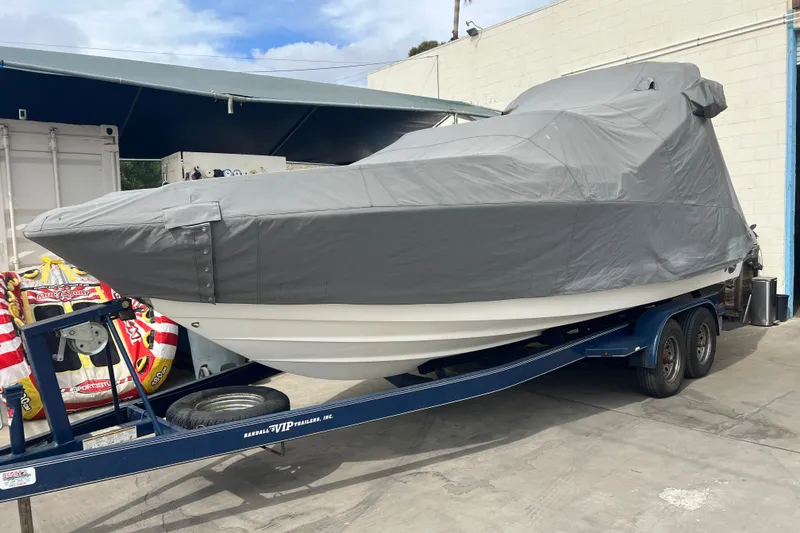Slide: The Image of Covered 2007 Chaparral 256 SSi boat on trailer in storage area. - 13