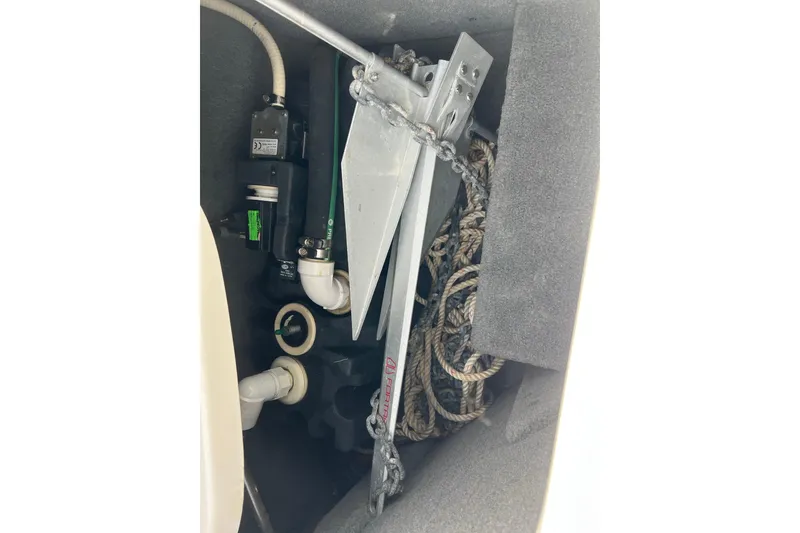 Slide: The Image of Storage compartment of a 2007 Chaparral 256 SSi boat with anchor and ropes. - 15