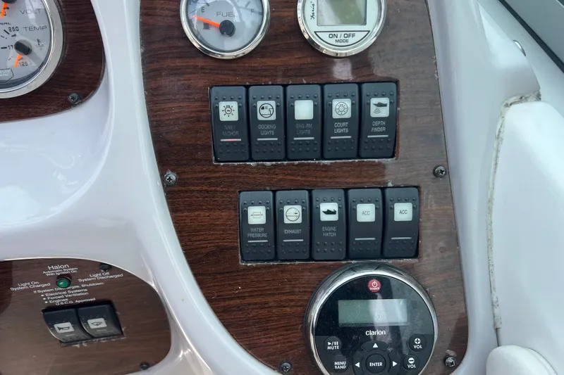 Slide: The Image of Dashboard controls of a 2007 Chaparral 256 SSi boat with gauges and switches. - 16