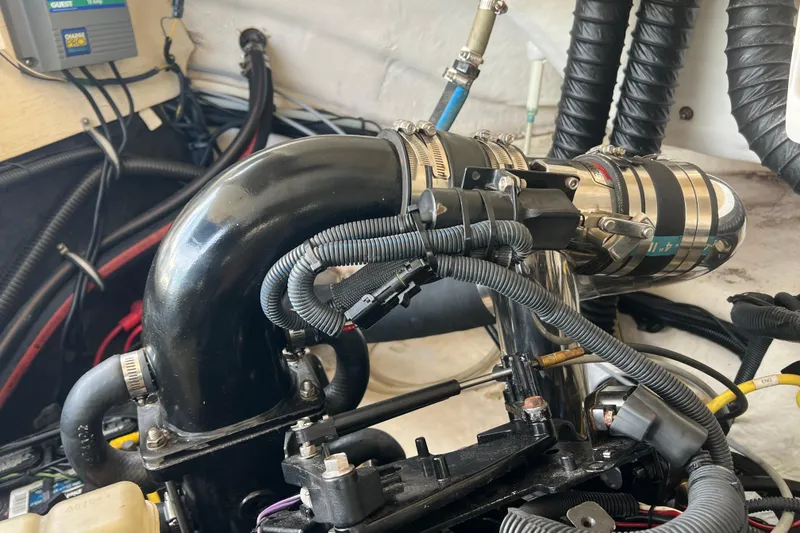 Slide: The Image of Engine compartment of a 2007 Chaparral 256 SSi boat, showing detailed wiring and components. - 18