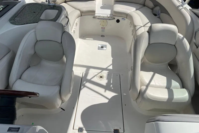 Slide: The Image of 2007 Chaparral 256 SSi boat interior with white seating and built-in sink. - 6