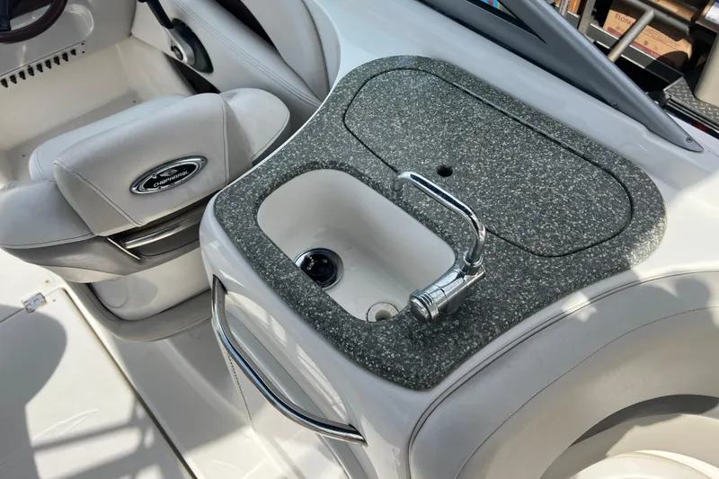 Slide: The Image of 2007 Chaparral 256 SSi boat interior with sink and seating area. - 9