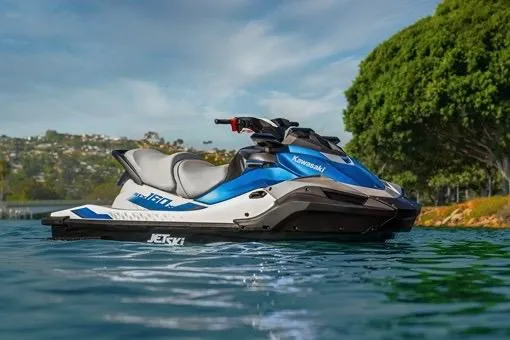 Slide: The Image of 2026 Kawasaki Jetski STX 160X on water, showcasing sleek design and vibrant blue color. - 2