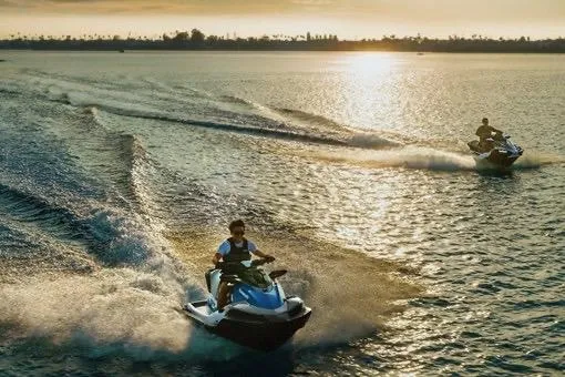 Slide: The Image of Two Kawasaki Jetski STX 160X models racing on water at sunset, 2026. - 8