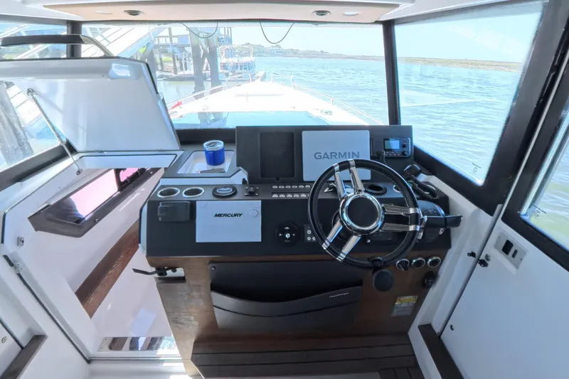 Slide: The Image of 2019 Axopar 37 XC Cross Cabin helm with Garmin navigation and Mercury controls. - 10