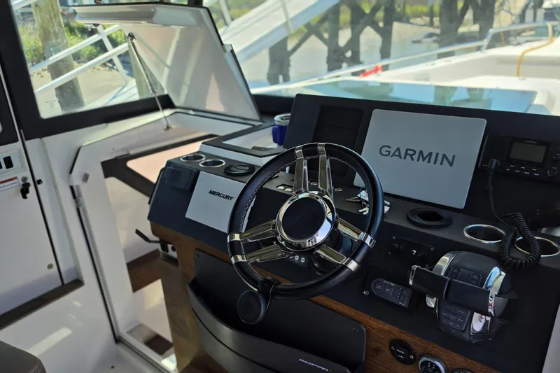 Slide: The Image of Steering console of 2019 Axopar 37 XC Cross Cabin with Garmin navigation system. - 7