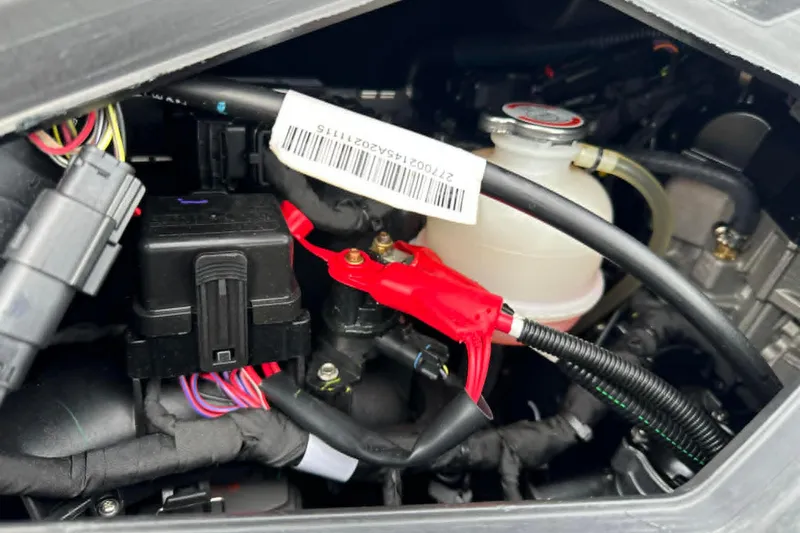 Slide: The Image of Engine compartment of a 2022 Sea-Doo Spark Trixx 2up, showing wiring and components. - 12