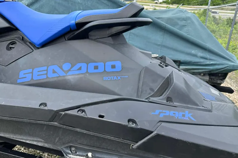 Slide: The Image of 2022 Sea-Doo Spark Trixx 2up jet ski with blue seat and branding. - 3