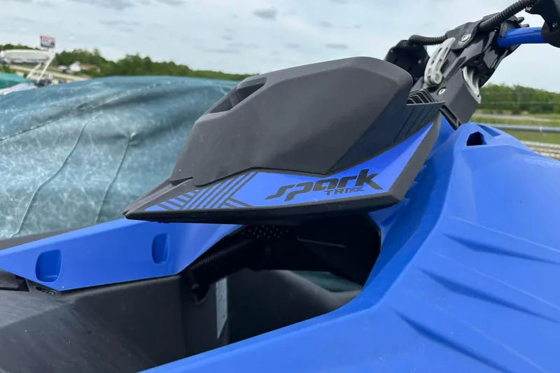 Slide: The Image of 2022 Sea-Doo Spark Trixx 2up in blue, close-up of handlebar and logo. - 6
