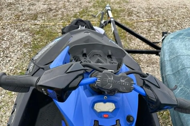Slide: The Image of 2022 Sea-Doo Spark Trixx 2up jet ski, blue, on a trailer. - 8