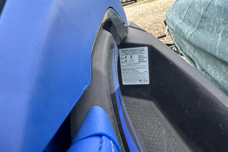 Slide: The Image of 2022 Sea-Doo Spark Trixx 2up, blue exterior, compliance label visible. - 9