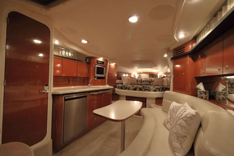 Slide: The Image of Luxurious interior of a 2004 Sea Ray 340 Sundancer yacht with elegant wood finishes. - 10