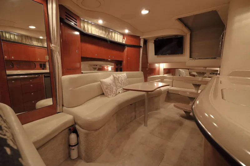 Slide: The Image of Luxurious interior of 2004 Sea Ray 340 Sundancer yacht with plush seating and modern amenities. - 12