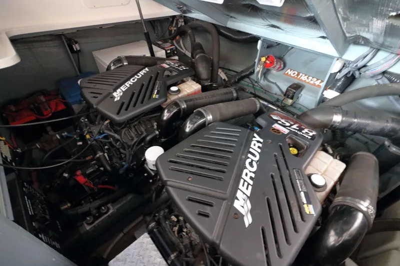 Slide: The Image of Engine compartment of a 2004 Sea Ray 340 Sundancer with Mercury engines. - 18
