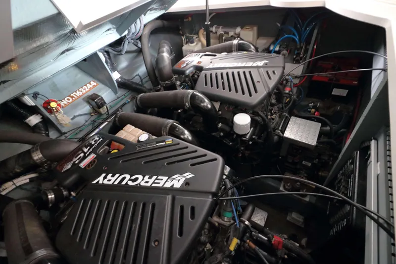 Slide: The Image of Engine compartment of a 2004 Sea Ray 340 Sundancer with twin Mercury engines. - 19