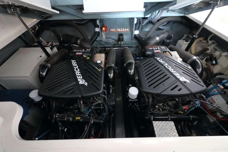 Slide: The Image of Engine compartment of a 2004 Sea Ray 340 Sundancer with twin Mercury engines. - 20