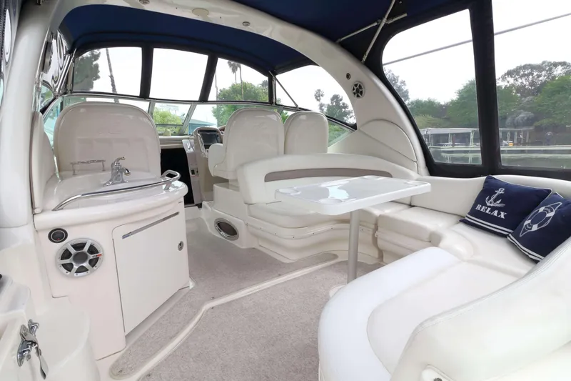 Slide: The Image of Interior of 2004 Sea Ray 340 Sundancer yacht with seating and table. - 3