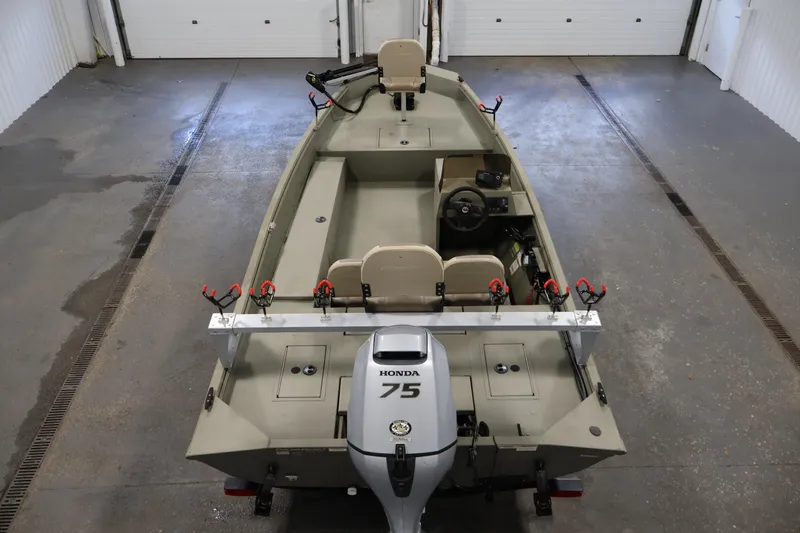 Slide: The Image of 2021 Polar Kraft Sportsman 1760 SE boat with Honda 75 engine in garage. - 10