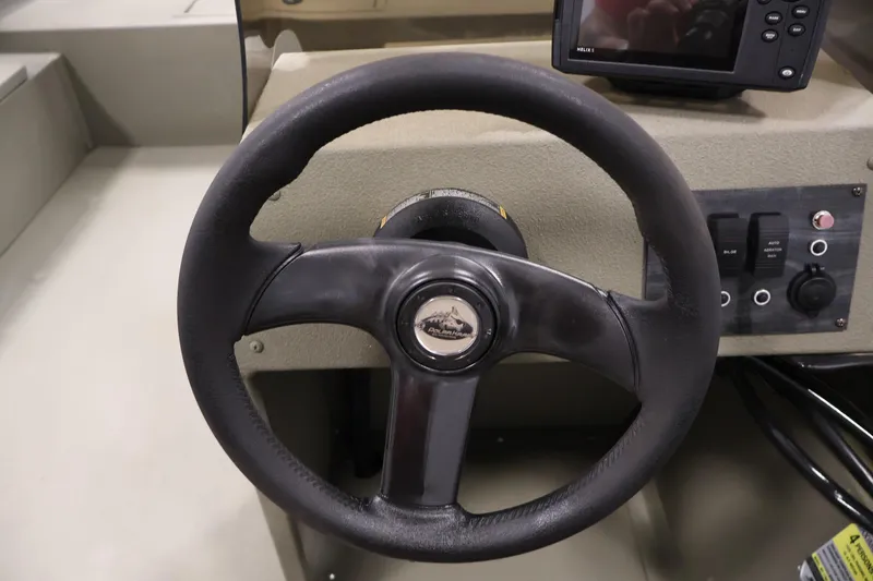 Slide: The Image of Steering wheel of 2021 Polar Kraft Sportsman 1760 SE boat with control panel. - 25