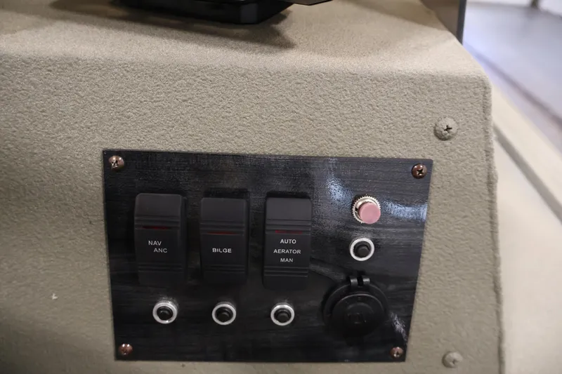 Slide: The Image of Control panel of 2021 Polar Kraft Sportsman 1760 SE boat with switches and buttons. - 27