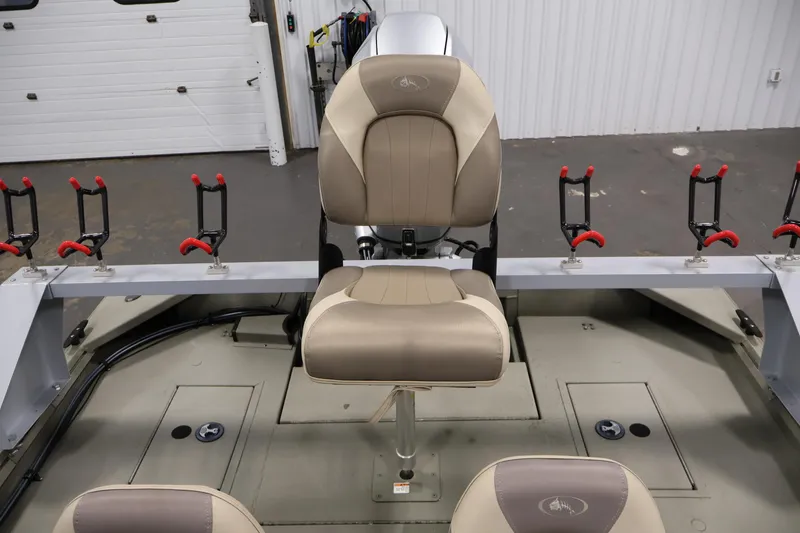 Slide: The Image of 2021 Polar Kraft Sportsman 1760 SE boat interior with fishing rod holders and seating. - 31