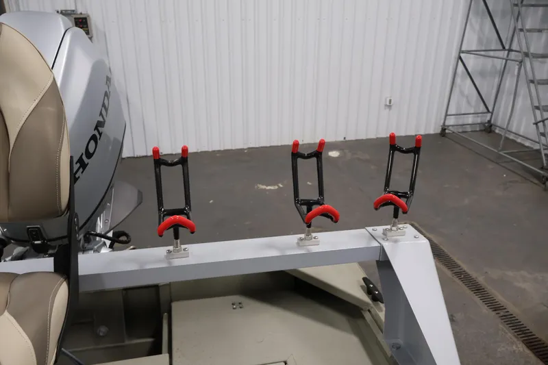 Slide: The Image of 2021 Polar Kraft Sportsman 1760 SE boat with Honda motor and rod holders. - 32