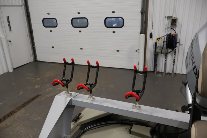 Slide: The Image of 2021 Polar Kraft Sportsman 1760 SE boat with rod holders in a garage setting. - 33