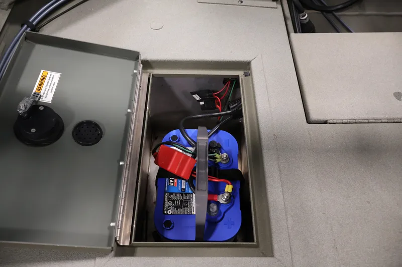 Slide: The Image of 2021 Polar Kraft Sportsman 1760 SE boat battery compartment with wiring. - 35
